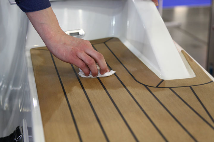 careful cleaning of Teak wood panels on yacht