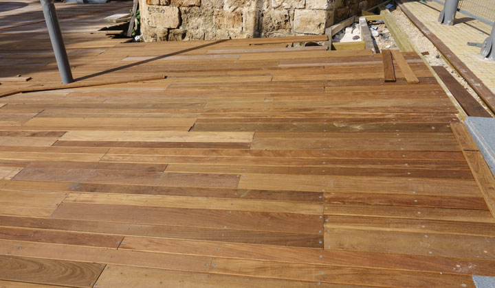 laying new decking wood pieces